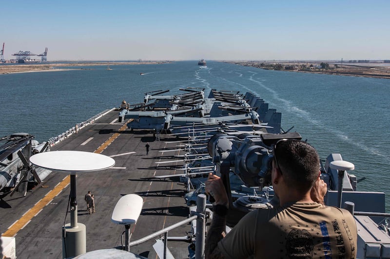 The USS Bataan amphibious assault ship transits the Suez Canal en route to the Red Sea. More than 3,000 military personnel have been sent aboard two warships in the wake of recent tanker seizures by Iran. AFP