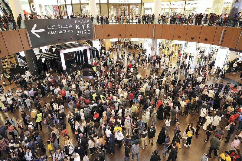  
DUBAI , UNITED ARAB EMIRATES – Dec 31 , 2019 : Crowd coming to watch the NYE 2020 fireworks at Dubai Mall in Dubai. ( Pawan Singh / The National ) For News/Online/Instagram
 
