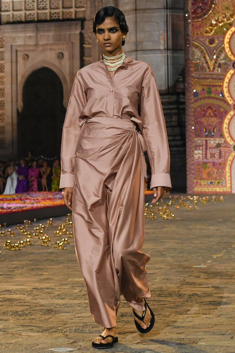A silk shirt and sari-inspired skirt in rose gold