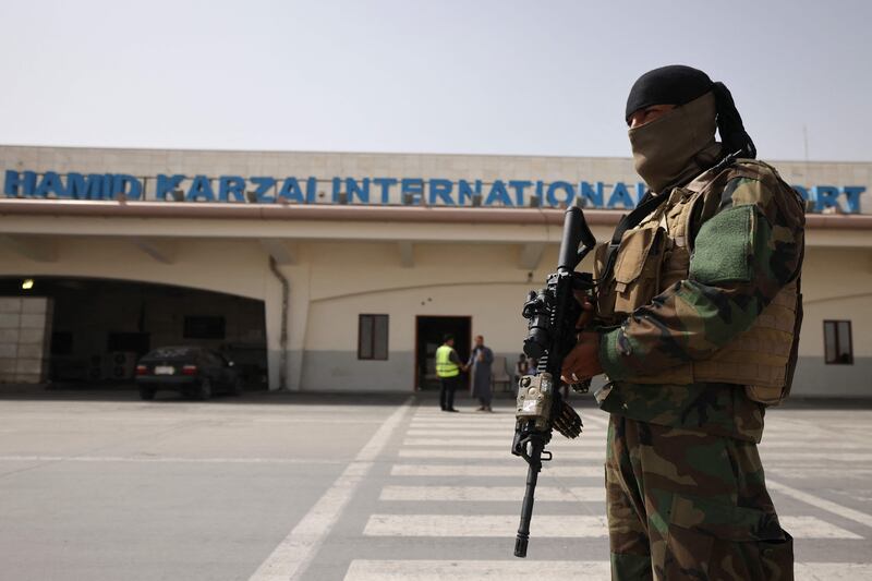A Taliban fighter stands guard at Kabul airport. Karim SAHIB / AFP