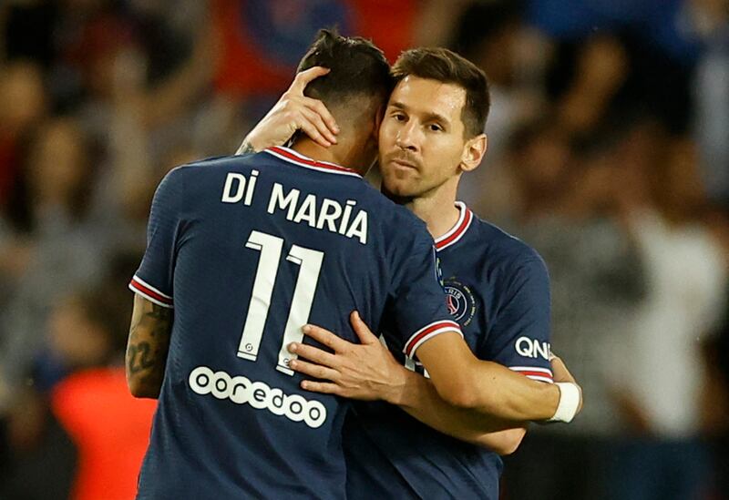 Angel Di Maria celebrates scoring the fifth goal with Lionel Messi. Reuters