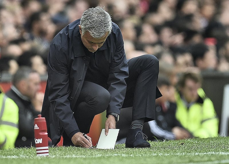 Manchester United's Portuguese manager Jose Mourinho makes notes on the touchline during the English Premier League football match between Manchester United and Manchester City at Old Trafford in Manchester, north west England, on September 10, 2016. / AFP PHOTO / Oli SCARFF / RESTRICTED TO EDITORIAL USE. No use with unauthorized audio, video, data, fixture lists, club/league logos or 'live' services. Online in-match use limited to 75 images, no video emulation. No use in betting, games or single club/league/player publications.  / 