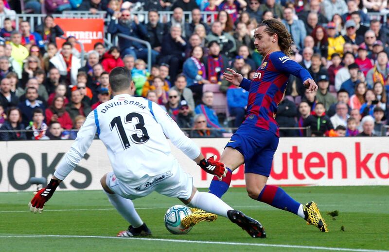 Barcelona's Antoine Griezmann scores against Getafe on Saturday. EPA