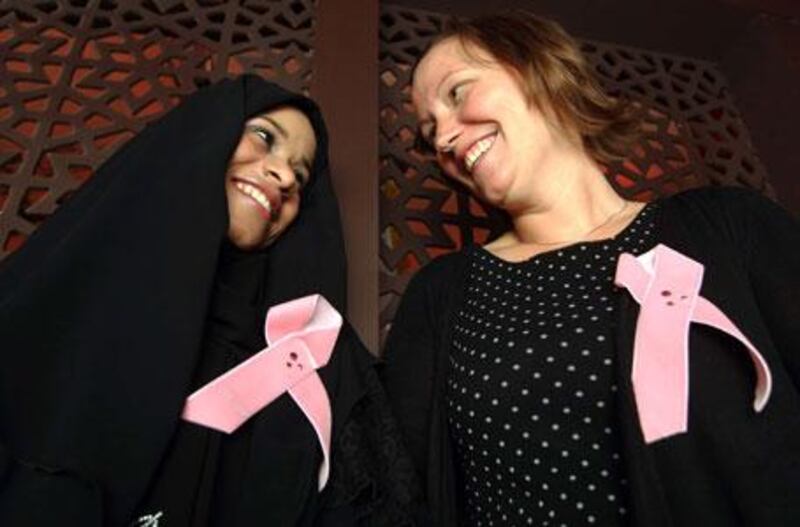 Breast cancer survivors Bushara Mohammed and Kristin Lovell at a screening of Healing and Hope on Wednesday night.