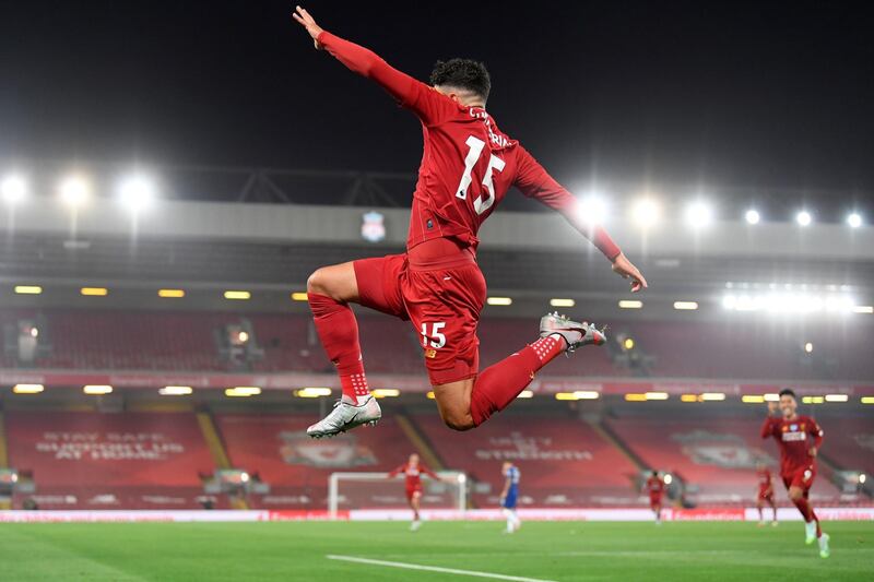 Liverpool's English midfielder Alex Oxlade-Chamberlain celebrates scoring his team's fifth goal during the English Premier League football match between Liverpool and Chelsea at Anfield in Liverpool, north west England. AFP