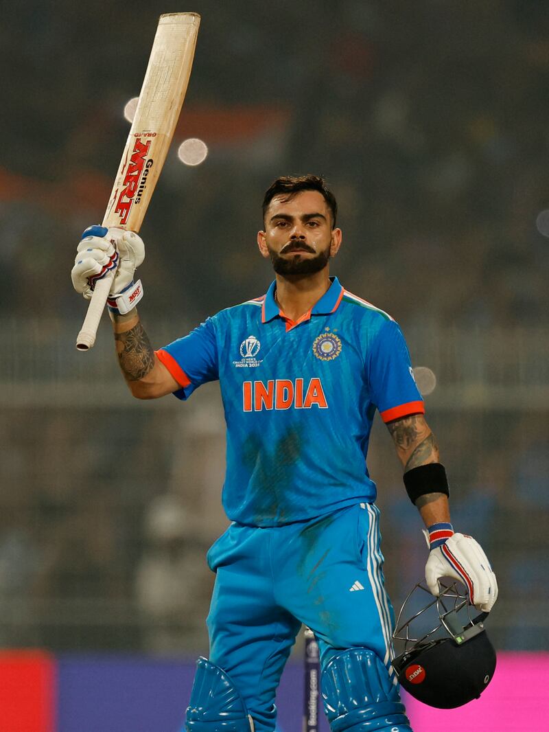 India's Virat Kohli celebrates after reaching his 49th century, equalising with Sachin Tendulkar's record of most number of ODI tons. Reuters