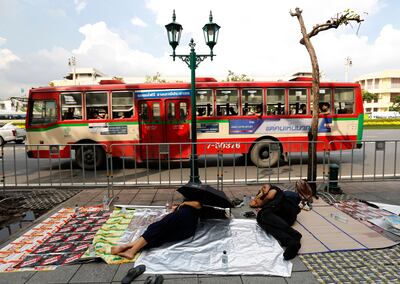 epa06285505 Thai mourners sleep in the main road to Sanam Luang, as they line up to wait to take part in the Royal Cremation ceremony of late King Bhumibol Adulyadej, in Bangkok, Thailand, 24 October 2017. The Royal Cremation ceremony of late King Bhumibol Adulyadej is scheduled on 26 October 2017, and the funeral will consist of five days of rites. King Bhumibol died at the age of 88 in Siriraj hospital on 13 October 2016 after 70 years on the throne.  EPA/NARONG SANGNAK