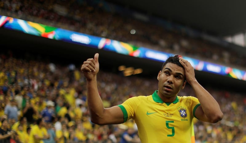 Brazil's Casemiro celebrates. The Real Madrid midfielder is suspended for Brazil's next game after picking up a second yellow card in the group stages against Peru. Reuters