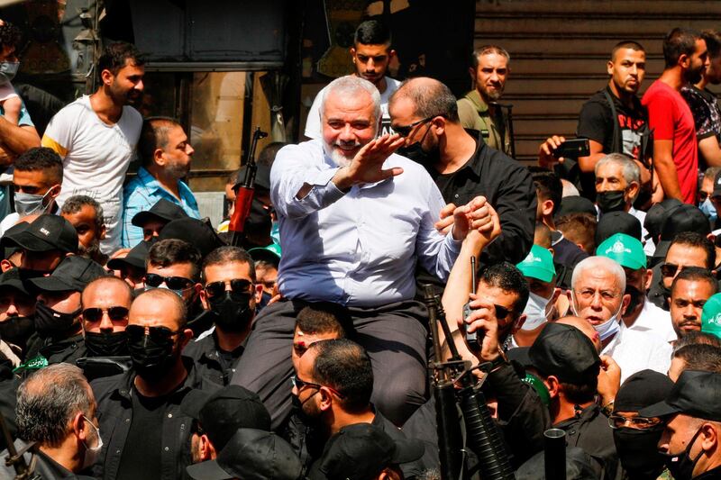 Hamas' political bureau chief Ismail Haniya greets supporters during a visit to the Ain el-Helweh camp, Lebanon's largest Palestinian refugee camp, near the southern coastal city of Sidon on September 6, 2020.  / AFP / Mahmoud ZAYYAT
