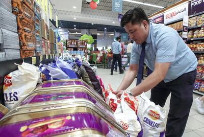 Abu Dhabi, United Arab Emirates, March 19, 2020.   Staff restock goods at the Lulu Hypermarket at Mushriff Mall during the Covid-19 pandemic.
Victor Besa / The National
Reporter:   Dasn Sanderson
Section:  NA