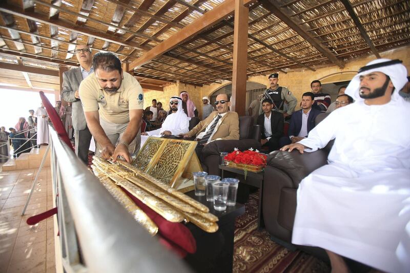 Emirati and Jordanian officials attend as Jordanian Bedouins prepare to race camels using robotic jockeys at the Sheikh Zayed track in the town of al-Disi in the desert of Wadi Rum valley, on November 9, 2019. (The National)