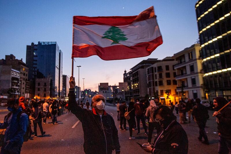 Anti-government protesters attend a protest against the collapsing Lebanese pound currency and the price hikes of goods in Beirut.  EPA