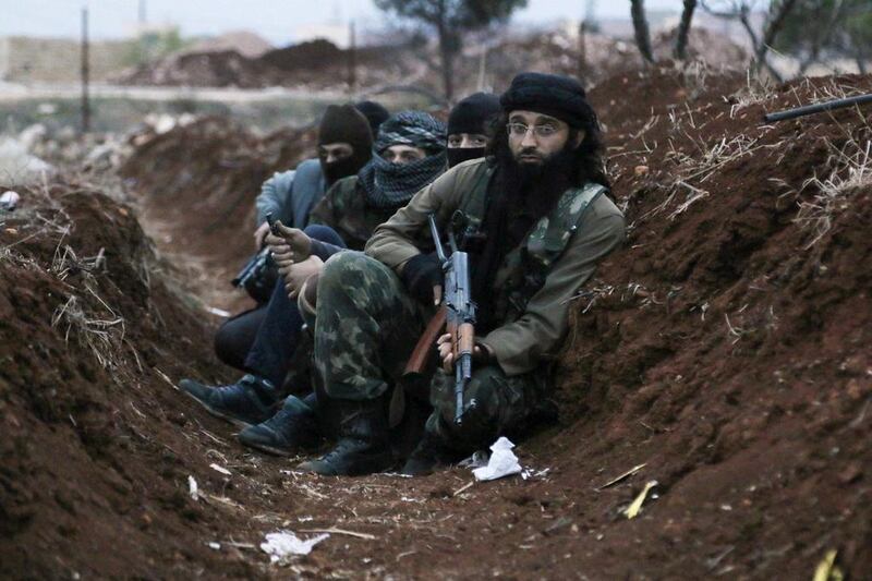 Members of Al Qaeda in a trench near Al Zahra village, north of Aleppo city on November 25, 2014. Reuters
