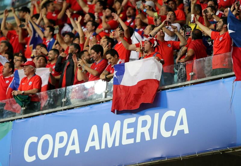Chile supporters cheer on their team inside the Fonte Nova Arena during the Copa America match against Ecuador. Reuters