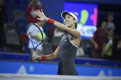 Garbine Muguruza of Spain celebrates after winning against Magda Linette of Poland during their third round women's singles match at the WTA Wuhan Open tennis tournament in  Wuhan, in China's central Hubei province on September 27, 2017. / AFP PHOTO / WANG ZHAO