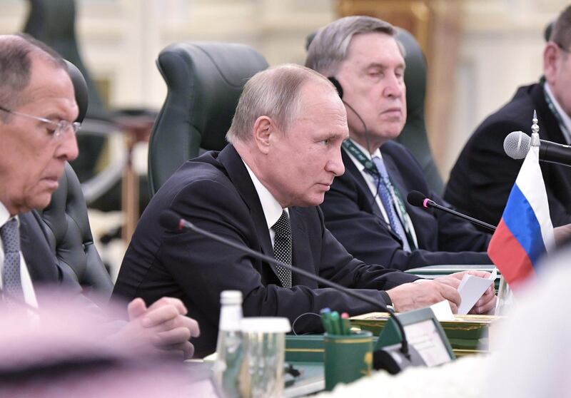 Mr Putin attends a meeting with King Salman. EPA
