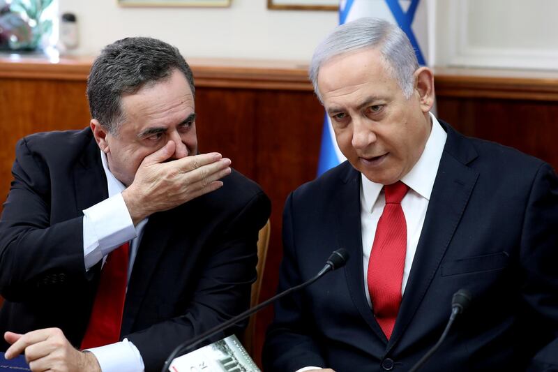 FILE PHOTO: Israeli Prime Minister Benjamin Netanyahu listens to Foreign Minister Israel Katz during the weekly cabinet meeting in Jerusalem October 27, 2019. Gali Tibbon/Pool via REUTERS/File Photo