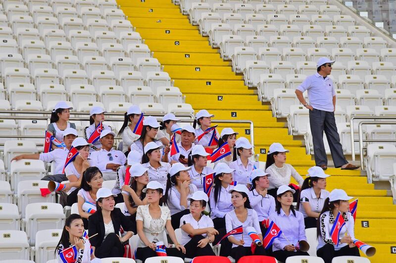 North Korea fans attend the 2019 AFC Asian Cup group E football match between North Korea and Qatar at the Khalifa bin Zayed stadium in al-Ain on January 13, 2018.  / AFP / Giuseppe CACACE
