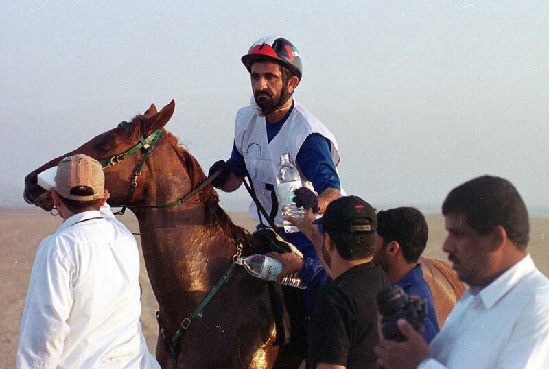Dubai's Crown Prince and United Arab Emirates' Defense Minister Sheik Mohammed Bin Rashid Al Maktoum, on Falah, takes a break during a horse race organized by an Egyptian newspaper, beside the Sakkara pyramids,12 miles (20 kilometers) north of Cairo Friday, May19, 2000. Only 18 of the 75 horses that participated finished  the 62.5 mile (100 kilometer) endurance race. The crown prince won with a  riding time of five hours and 34 minutes. (AP Photo)