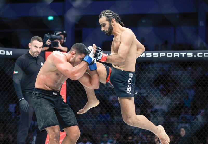 Abu Dhabi, United Arab Emirates, October 18, 2019.  UAE Warriors Fighting Championship at the Mubadala Arena.----    
Ahmad Labban gives a flying knee to the head of Sofiane Benchora to take the win in the welterweight division.
Victor Besa/The National
Section:  SP
Reporter:  Amith Passela