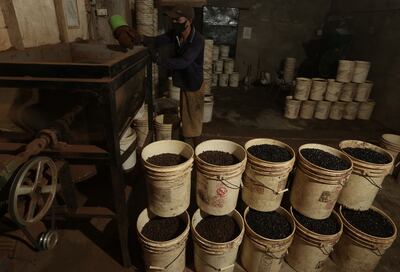 A worker grinds coffee seeds in a small factory in Pringsewu, Indonesia. AFP