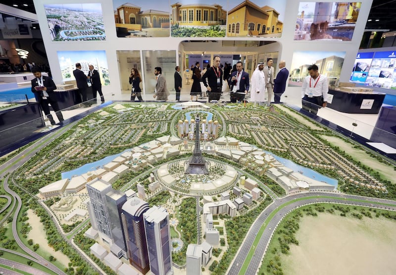 Dubai, United Arab Emirates - October 02, 2018: People at the FalconCity, world in a city model at Cityscape Global 2018. Tuesday, October 2nd, 2018 at World Trade Centre, Dubai. Chris Whiteoak / The National