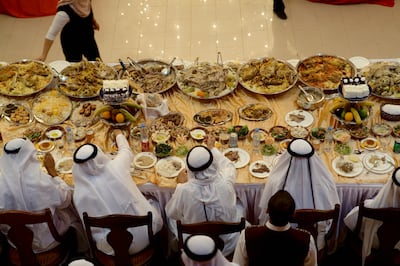 Umm al-Quwain, UAE - June 13, 2009 - Guests at a mass wedding sit in the dining hall.  19 grooms received gifts and greeted Sheikh Saud bin Rashid Al Mu'alla, ruler of Umm al-Quwain (not pictured) (Nicole Hill / The National) *** Local Caption ***  NH Wedding25.jpgna15ju-wedding-secondary.jpgna15ju-wedding-secondary.jpg