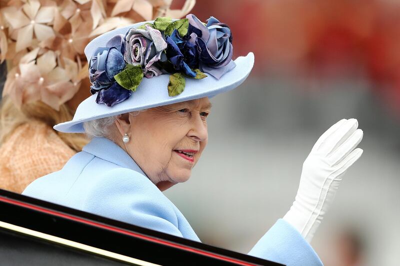 Queen Elizabeth II waves to the crowds as she arrives on Day 1 of Royal Ascot. Getty Images