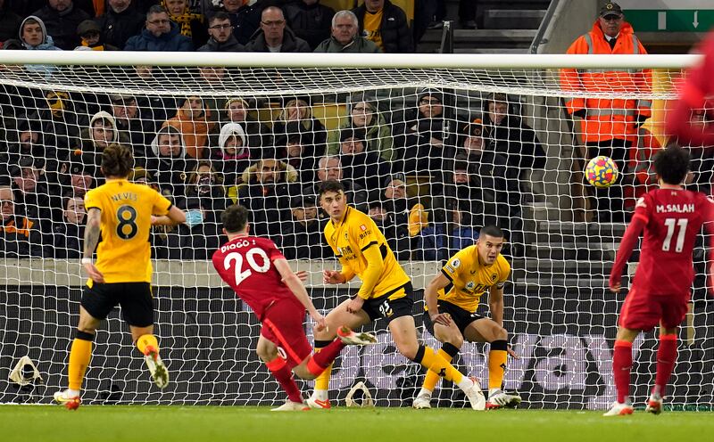 Liverpool's Diogo Jota sees his shot blocked on the line by Wolves defender Conor Coady. PA