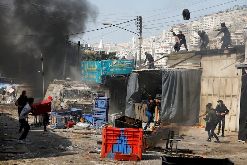 Palestinians clash with Israeli forces in Nablus. Reuters