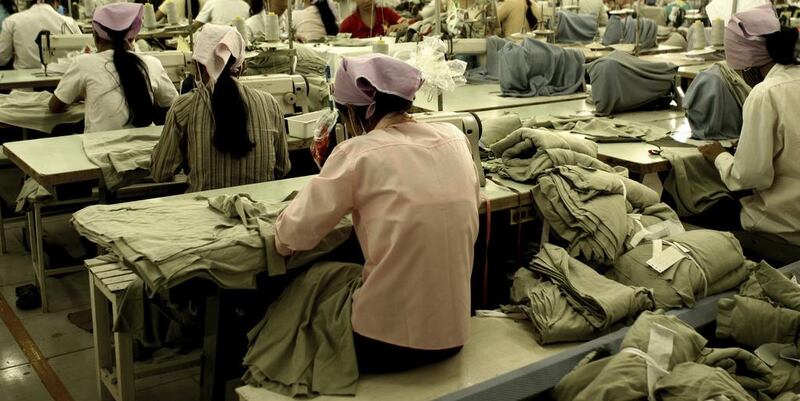 Workers at a garment factory in South East Asia. iStockphoto.com