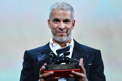 French Tunisian actor Sami Bouajila holds the Orizzonti Award for Best Actor he received for the film "Un Fils" (Bik Eneich, A Son) during the awards ceremony of the 76th Venice Film Festival on September 7, 2019 at Venice Lido.  / AFP / Alberto PIZZOLI
