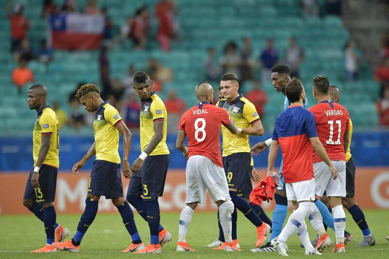 Chile players Arturo Vidal and Eduardo Vargas shake hands with Ecuador players at the end of the game. AFP