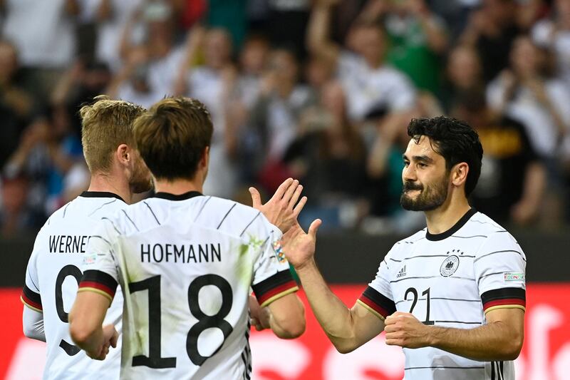Ilkay Gundogan (R) celebrates scoring the second for Germany. AFP