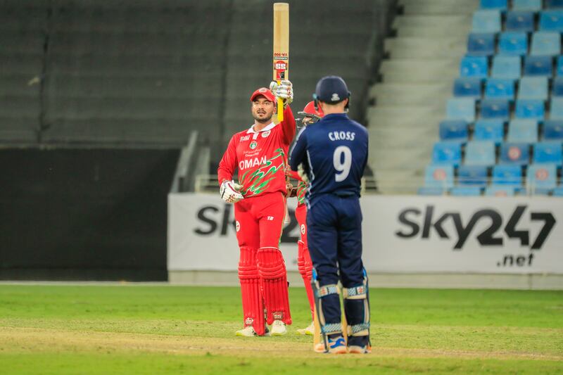 Ayaan Khan raises his bat after reaching his half century against Scotland. Photo: ICC
