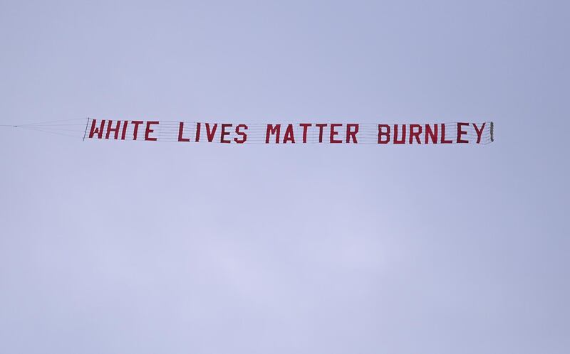 A "White Lives Matter Burnley" banner is seen tied to a plane above the Etihad Stadium. Reuters