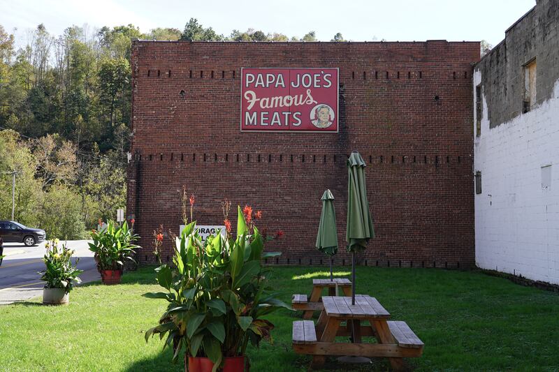 A sign for "Papa Joe's famous meats" still hangs on the exterior of a building in Farmington, West Virginia. Willy Lowry / The National