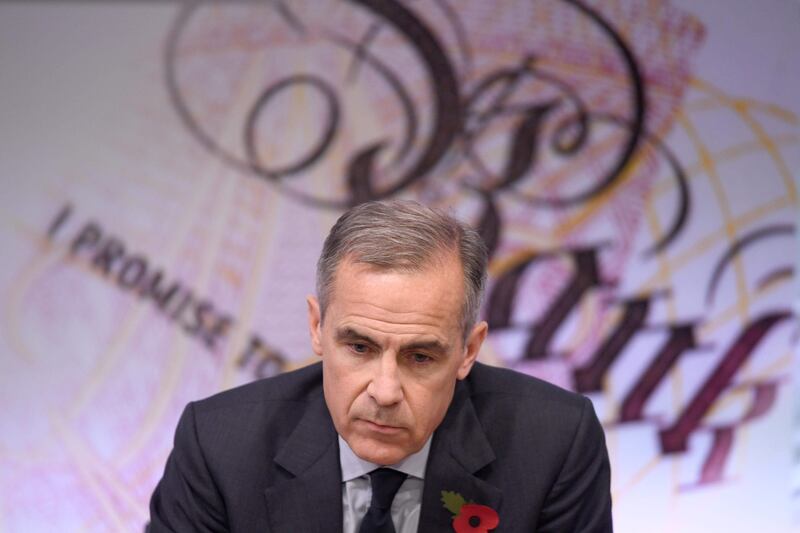 Governor of the Bank of England Mark Carney takes part an announcement of the Bank of England quarterly Inflation Report and interest rate decision at the Bank of England in London on November 2, 2017. 
The Bank of England raised its main interest rate for the first time since 2007, before the global financial crisis, it announced as it tackles Brexit-fuelled inflation. / AFP PHOTO / POOL / Stefan Rousseau