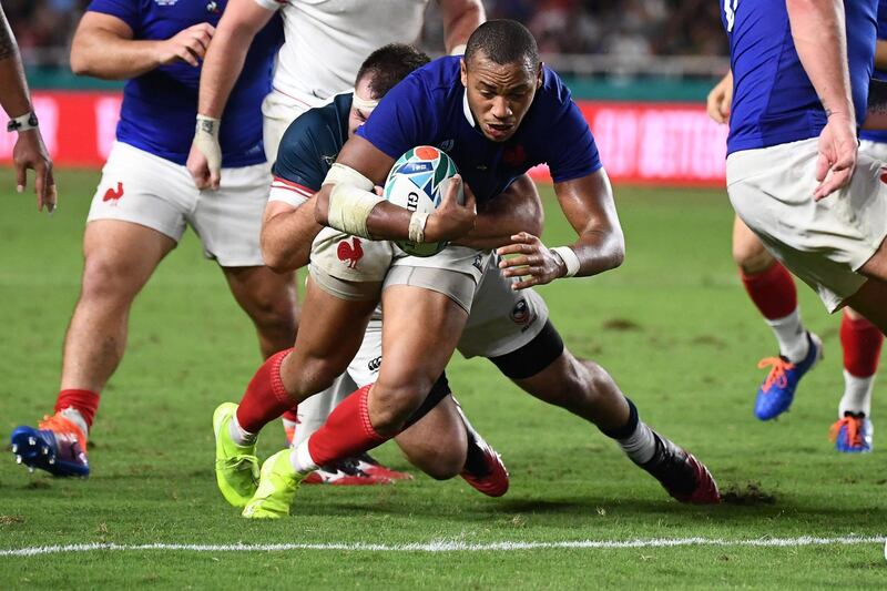 France's centre Gael Fickou (R) scores a try  during the Japan 2019 Rugby World Cup Pool C match between France and the United States at the Fukuoka Hakatanomori Stadium in Fukuoka. AFP