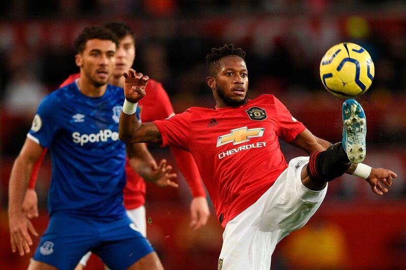 Manchester United's Brazilian midfielder Fred (R) controls the ball against Everton. AFP