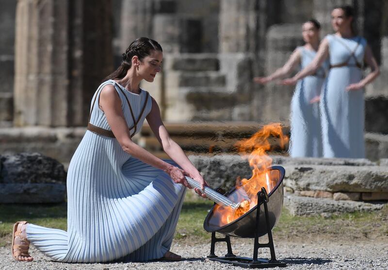 Greek actress Xanthi Georgiou, playing the role of High Priestess lights the flame during the Olympic flame lighting ceremony