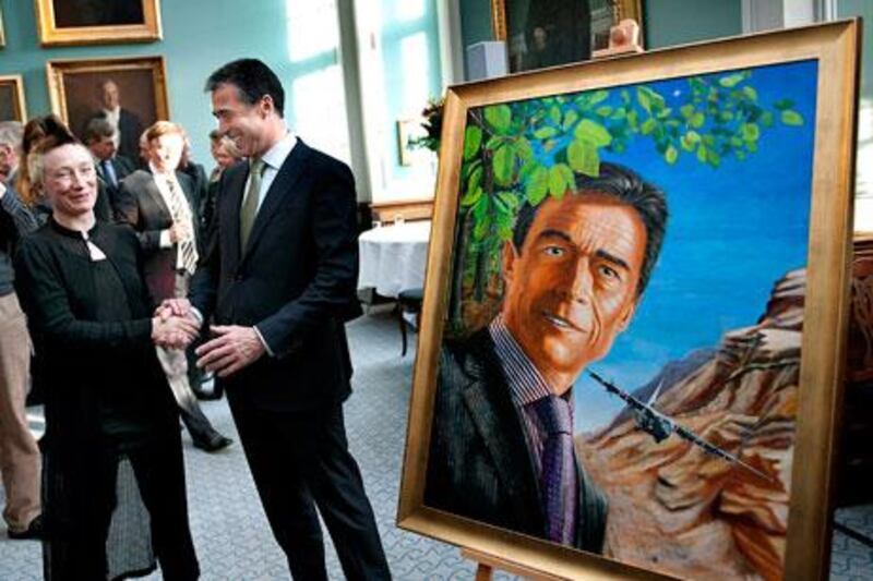 The artist Simone Aaberg Kaern with Anders Fogh Rasmussen, the Nato secretary general and former Danish prime minister, at the unveiling of her portrait of him. She is now Denmark’s official war artist in Libya