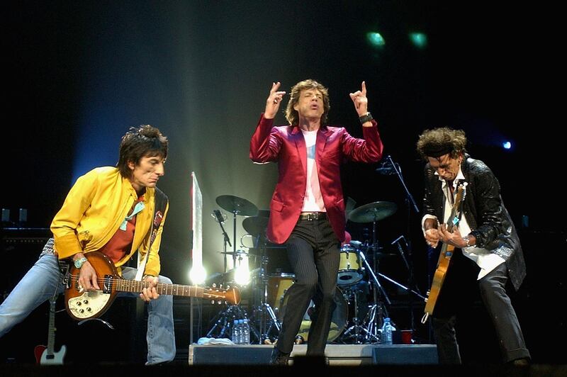 SYDNEY, AUSTRALIA - FEBRUARY 22:  (L-R)  Members of the Rolling Stones, Ronnie Woods, Mick Jagger and Keith Richards, perform live on stage at the Sydney Superdome February 22, 2003 in Sydney, Australia. The Rolling Stones will play in three major Australian cities as part of their 40 Licks World Tour 2003.  (Photo by Chris McGrath/Getty Images)