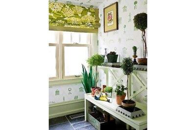 Wallpaper and house plants bring a garden theme indoors.