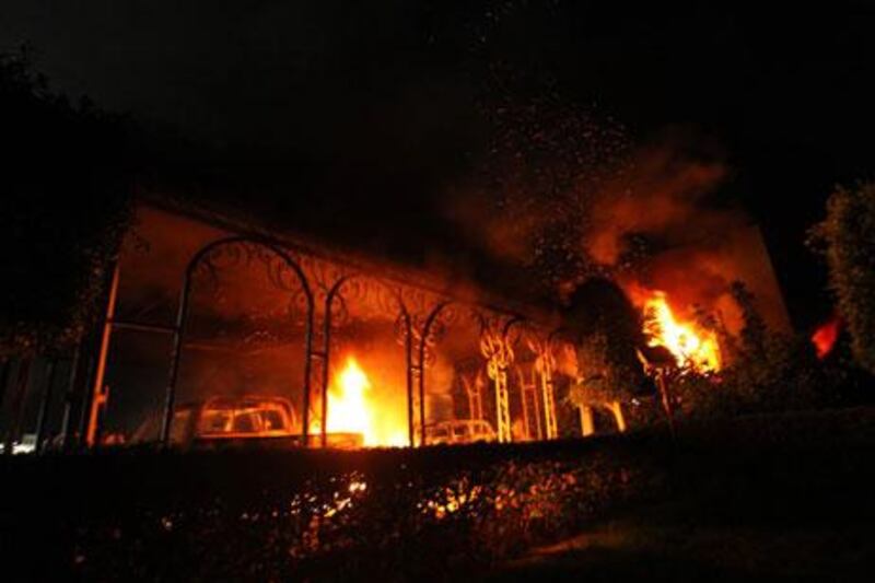The US Consulate in Benghazi is seen in flames during a protest by an armed group.