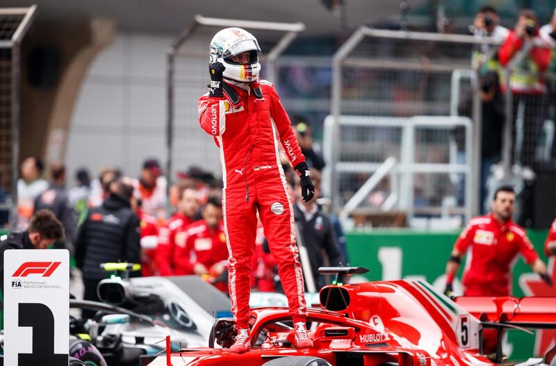 SHANGHAI, CHINA - APRIL 14:  Pole position qualifier Sebastian Vettel of Germany and Ferrari celebrates in parc ferme during qualifying for the Formula One Grand Prix of China at Shanghai International Circuit on April 14, 2018 in Shanghai, China.  (Photo by Lars Baron/Getty Images)