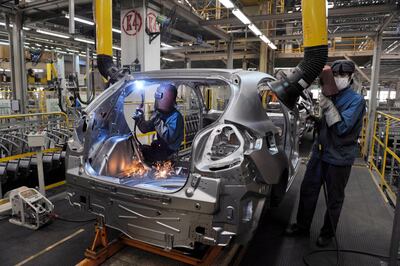 epa07086002 (FILE) - Production line workers build passenger cars at Brilliance Automotive, in Shenyang City, Liaoning Province, China, 13 May 2009 (reissued 11 October 2018). German carmaker BMW announced on 11 October 2018, that it will pay 3.6 billion euro to take control over its business in China, the Brilliance China Automotive Holdings. Under the new deal -- which is subject to regulatory and shareholder approval and expected to close in 2022, when China will relax ownership rules for car manufacturing operations in the country -- BMW will increase its stake from 50 to 75 percent, media reported.  EPA/MARK *** Local Caption *** 01728527