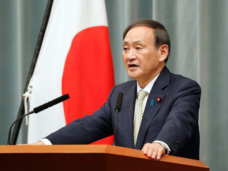 Japan's Chief Cabinet Secretary Yoshihide Suga speaks during a press conference in Tokyo, Tuesday Oct. 23, 2018. Japan's government said Tuesday that a man believed to be a Japanese freelance journalist who went missing three years ago while in Syria has been released and is now in Turkey. Suga told a hastily arranged news conference late Tuesday that Japan was informed by Qatar that the man, believed to be journalist Jumpei Yasuda, has been released. (Kyodo News via AP)