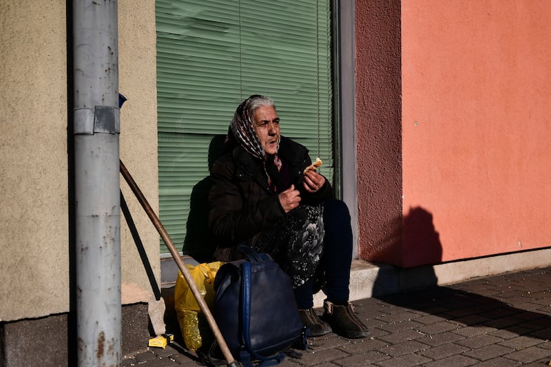 A refugee who fled conflict in Ukraine rests at a railway station after arriving in Zahony, Hungary. AP