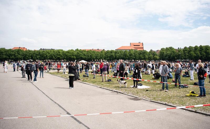 epa08426121 People gather during a demonstration against coronavirus restrictions at the Theresienwiese in Munich, Bavaria, Germany, 16 May 2020.   EPA